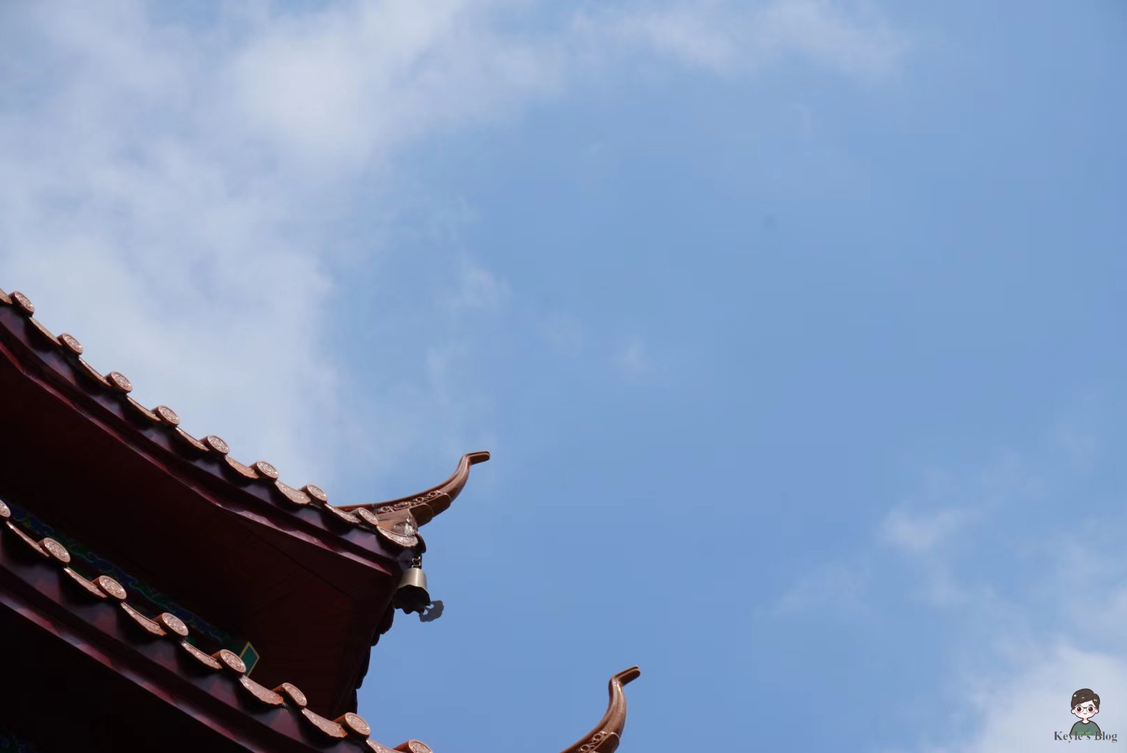 The eaves like a cliff, the bells like the sea