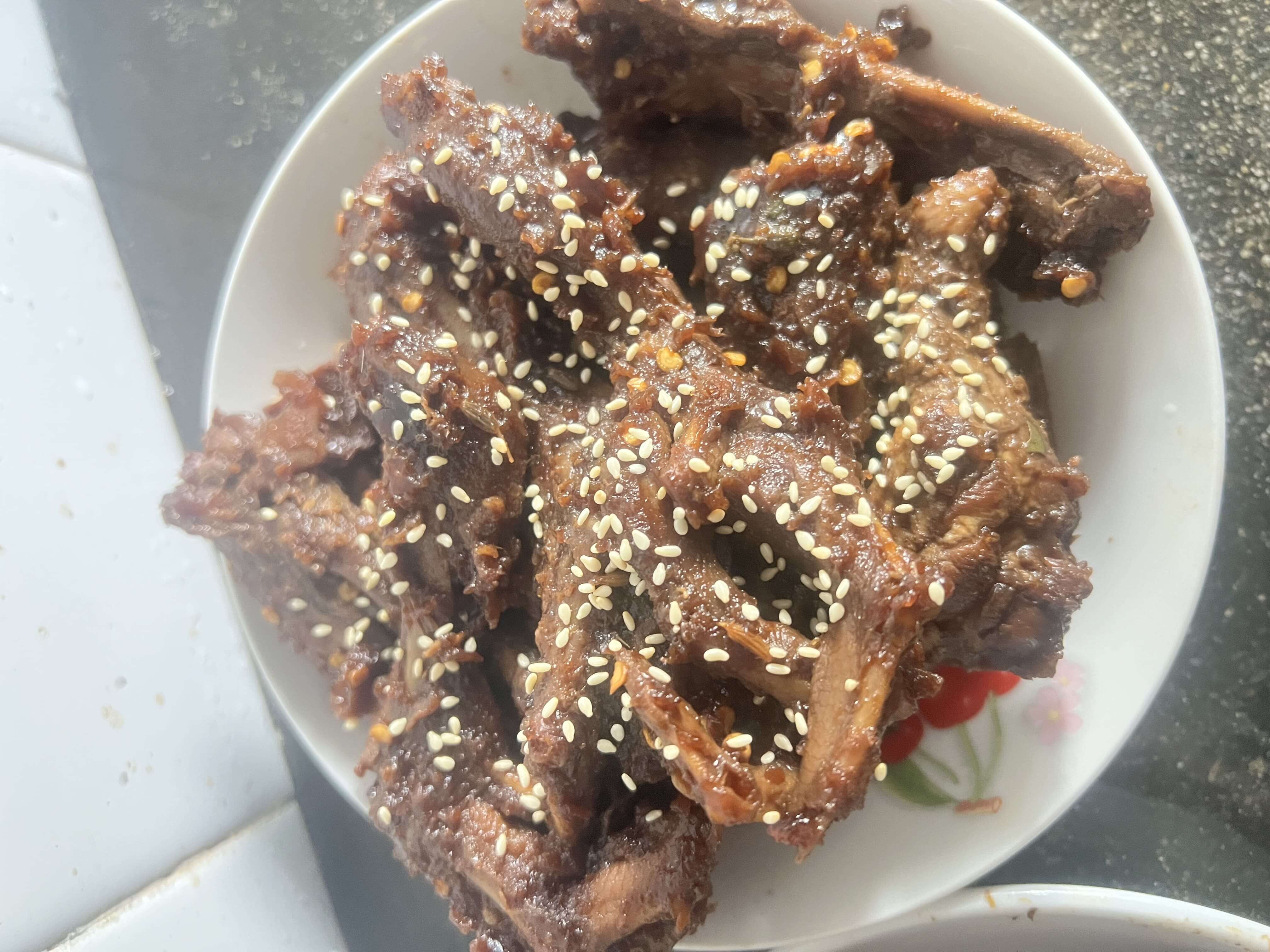Duck necks and duck feet topped with sesame