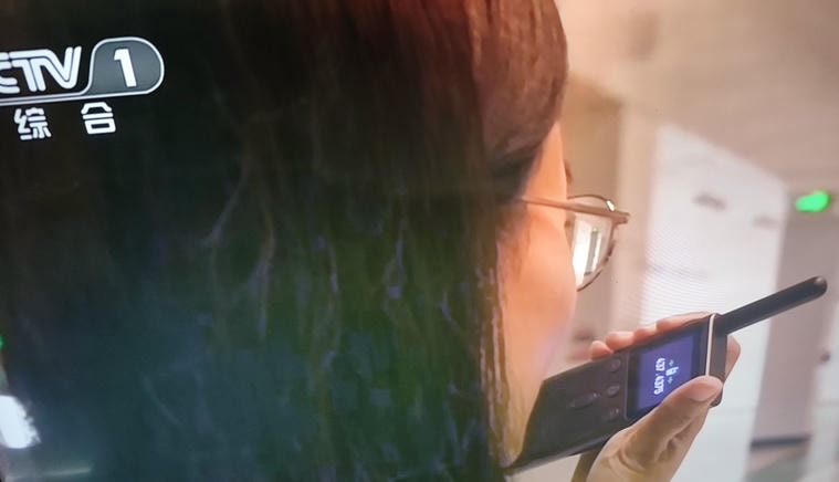 A walkie-talkie shown on TV using 437.4375 MHz, which falls exactly into this category