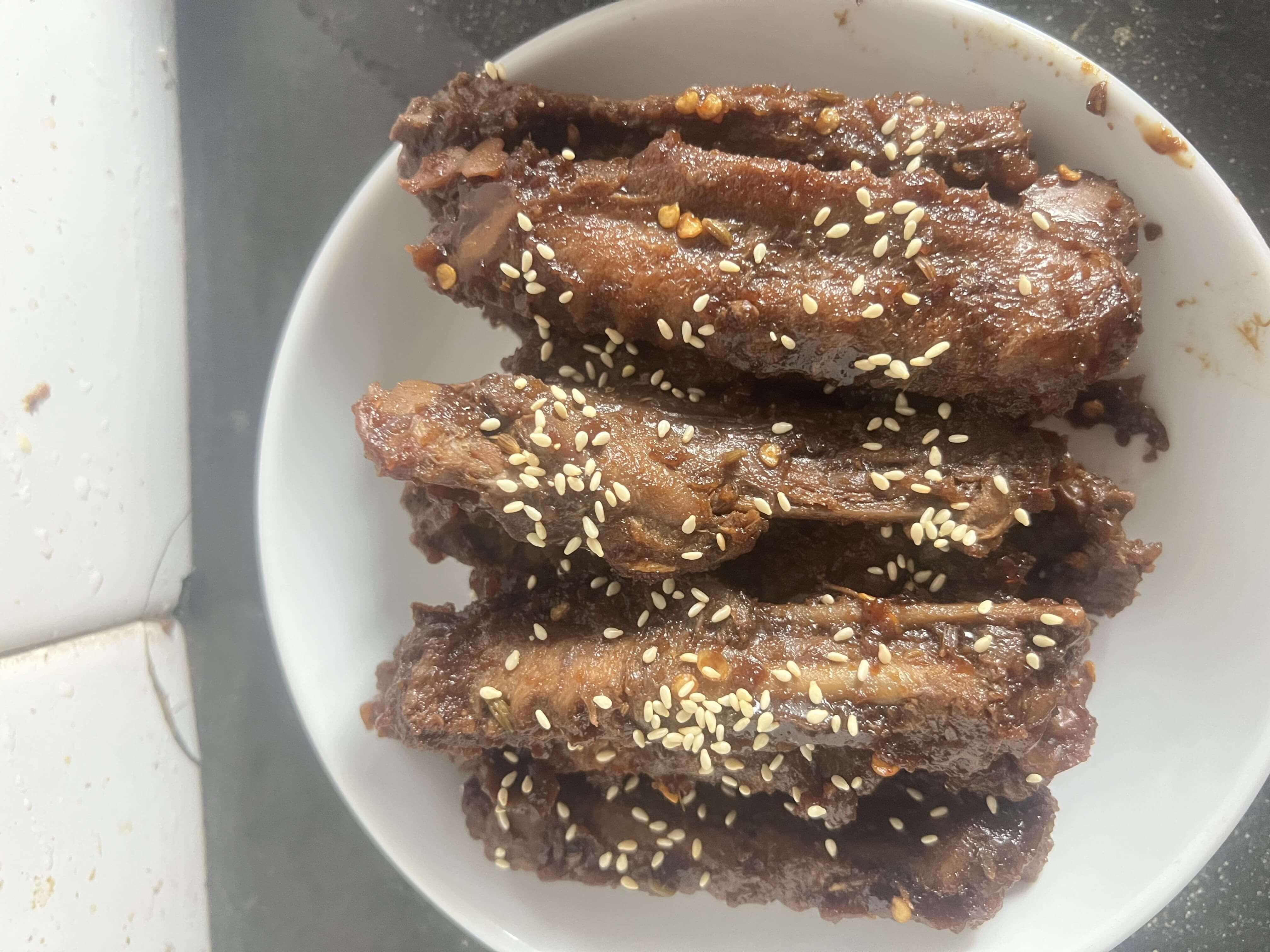 Duck wings topped with sesame